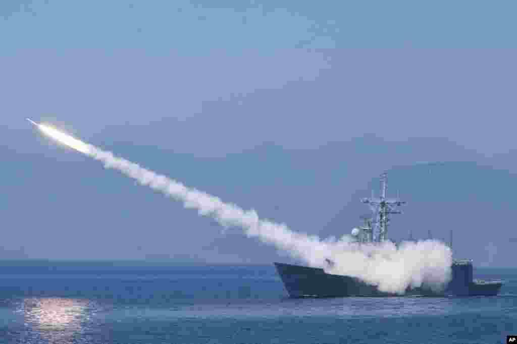 A Cheng Kung class frigate fires an anti-air missile as part of a navy demonstration in Taiwan&#39;s yearly Han Kuang exercises off the island&#39;s eastern coast near the city of Yilan.