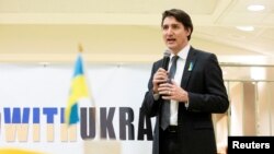 Canada's Prime Minister Justin Trudeau visits a Ukrainian church to speak with members of the Ukrainian community as Russia's invasion of Ukraine continues, in Toronto, Canada, March 4, 2022. 