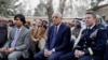FILE - U.S. envoy for peace in Afghanistan Zalmay Khalilzad (C) and U.S. Army General Scott Miller, commander of NATO's Resolute Support Mission, attend President Ashraf Ghani's inauguration, in Kabul, March 9, 2020.