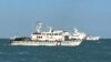 대만 해안 경비대가 14일 촬영해 공개한 사진은 진먼 앞바다에서 대만 해안 경비대 선박을 지나가는 중국 해안 경비대 선박의 모습을 보여준다.