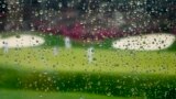 Rain falls on a plexiglass divider in the grandstand at Augusta National golf course on April 6, 2022, in Augusta, Ga. (AP Photo/Charlie Riedel)