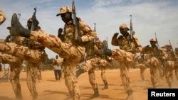 FILE - Chadian soldiers march during Flintlock 2014, a U.S.-led training mission for African militaries, in Diffa, Niger, March 3, 2014. The ruling junta in Niger has revoked an accord governing the roughly 1,000 U.S. military personnel there, the Pentagon said March 18, 2024.