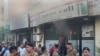 Lebanese soldiers gather outside a damaged mobile shop after what is believed to be the result of a walkie-talkie exploding inside it, in the southern port city of Sidon, Lebanon, Sept. 18, 2024.