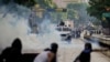 FILE - Protesters clash with police during demonstrations against the official election results declaring President Nicolas Maduro's reelection, the day after the vote in Caracas, Venezuela, July 29, 2024.