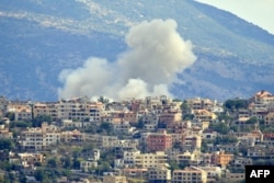 Smoke billows from the site of an Israeli airstrike in the southern Lebanese village of Khiam near the border, Sept. 19, 2024.