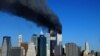 (FILE) The twin towers of the World Trade Center billow smoke after hijacked airliners crashed into them early 11 September, 2001. The suspected terrorist attack has caused the collapsed of both towers. AFP PHOTO/Henny Ray ABRAMS (Photo by HENNY RAY ABRAMS / AFP)