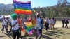 FILE - People take part in Eswatini's first gay pride demonstration in Mbabane, June 30, 2018. Human rights lawyer Sibusiso Nhlabatsi says the harsh legal environment for LGBTQ people in the kingdom causes significant problems for them. 