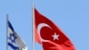 FILE - A Turkish flag flutters atop the Turkish embassy as an Israeli flag is seen nearby, in Tel Aviv, Israel, June 26, 2016. 