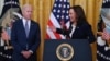 (FILES) Vice President Kamala Harris speaks as President Joe Biden looks on during an event to mark the passage of the Juneteenth National Independence Day Act, in the East Room of the White House, June 17, 2021, in Washington.