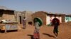 FILE - Eritrean refugee children walk within Mai-Aini refugee camp near the Eritrean boarder in the Tigrai region in Ethiopia, Feb. 10, 2016. 