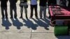 FILE - Suspected members of Sinaloa drug cartel and weapons are presented to the media in Tijuana, Mexico, Jan. 20, 2011. The U.S. Treasury Department imposed sanctions July 1, 2024, against three individuals accused of laundering money for the Sinaloa cartel. 