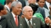 South African President Nelson Mandela, left, and Deputy President F.W. de Klerk chat outside Parliament after the approval of South Africa's new constitution May 8, 1996. (AP Photo, file) 