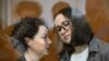 Russian theatre director Yevgeniya Berkovich, left, and playwright Svetlana Petriychuk, detained on charges of justification of terrorism over their award-winning play about Russian Islamic State brides, appear in court in Moscow on May 20, 2024.
