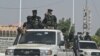 Chad police officers patrol the streets in N'Djamena on May 10, 2024, a day after the announcement of the results of Chad's presidential election.