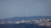 A picture taken from northern Israel shows flares launched by the Israeli army over the southern Lebanese village of Khiam on Sept 16, 2024.