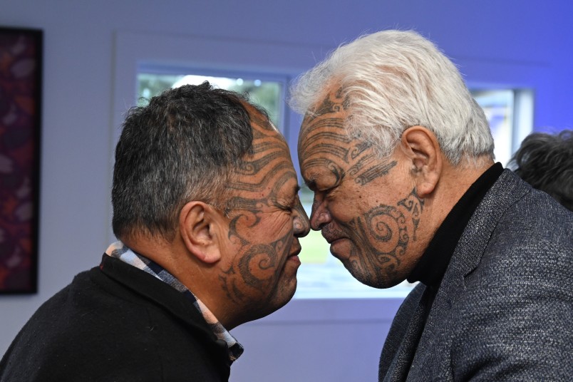 Old schoolfriends Joe Harawira and Victor Walker share a hongi