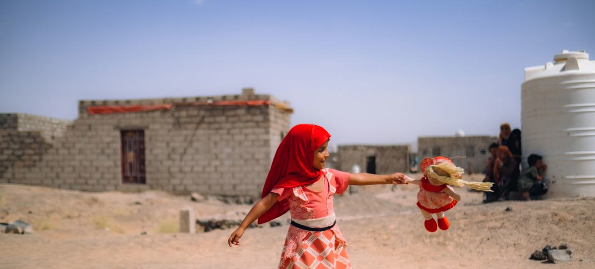 A girl plays in Al-Jufaina camp for displaced people in Marib, Yemen.