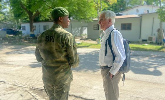 William O’Neill (right), the UN’s designated expert on the human rights situation in Haiti talks to a Haitian police officer in Port-au-Prince.