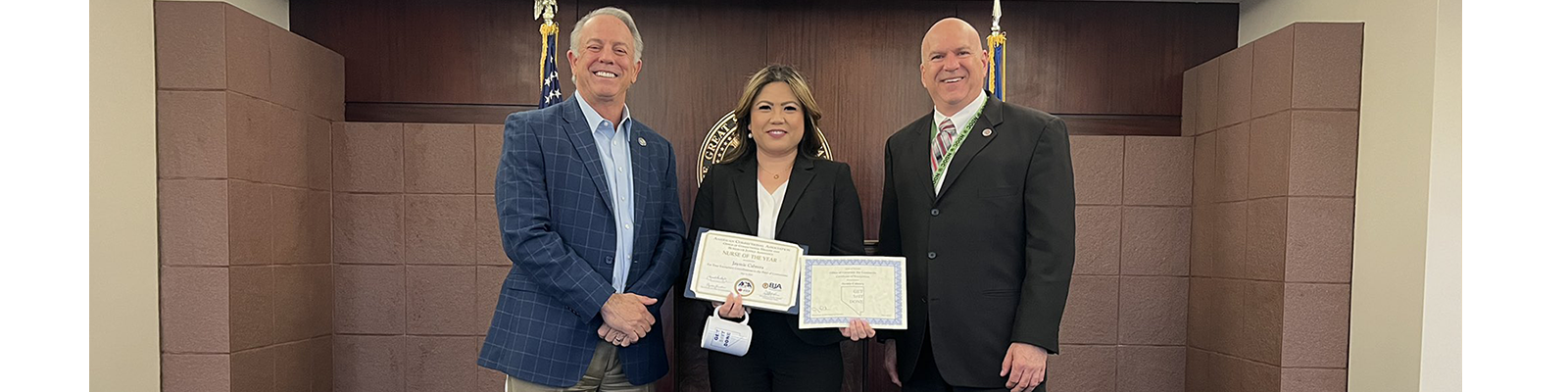 Governor Lombardo giving Jaymie Cabrera, Department of Corrections