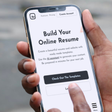 hands holding phone using resoume app