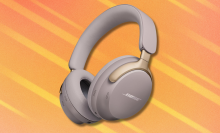 Bose QuietComfort Ultra headphones on orange abstract background