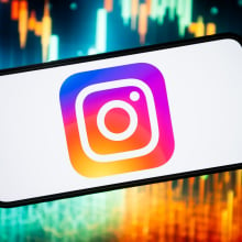 In this photo illustration, an Instagram logo seen displayed on a smartphone.