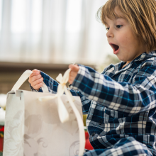 Close up boy on the floor with gift