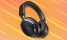 Bose QuietComfort Ultra headphones on orange abstract background