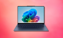 Lenovo yoga slim laptop against a pink background 