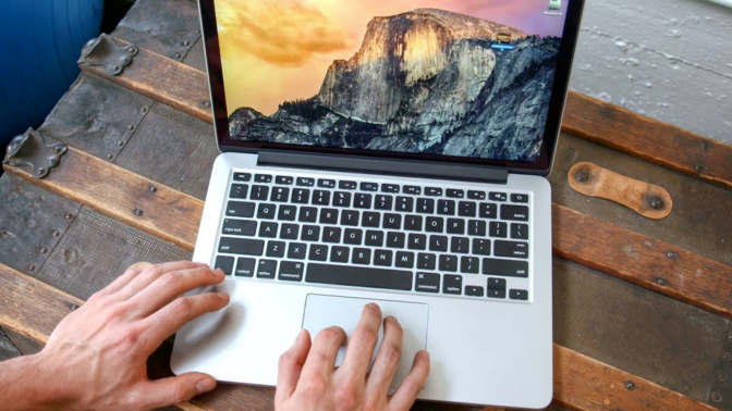 hands typing on refurbished MacBook Pro