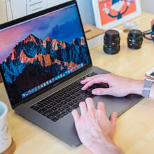 man using an apple macbook