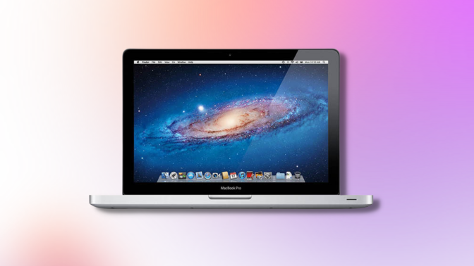 2015 Apple MacBook Pro with pink gradient background