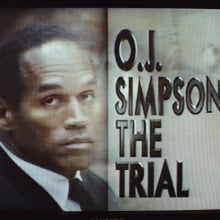 OJ Simpson on trial on a TV screen.