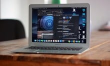 Gray MacBook Air computer resting on a table in an open position