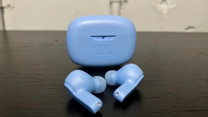 A pair of JBL Vibe Beam headphones in light blue