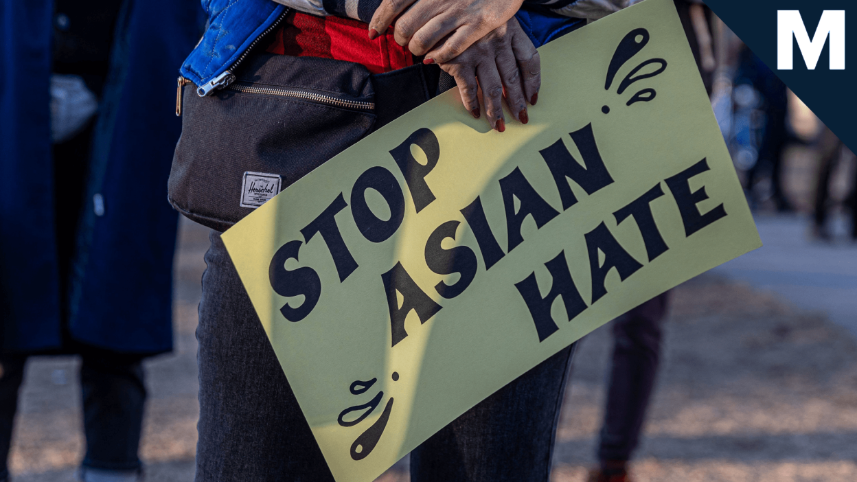 A yellow sign that reads 'Stop Asian Hate.'