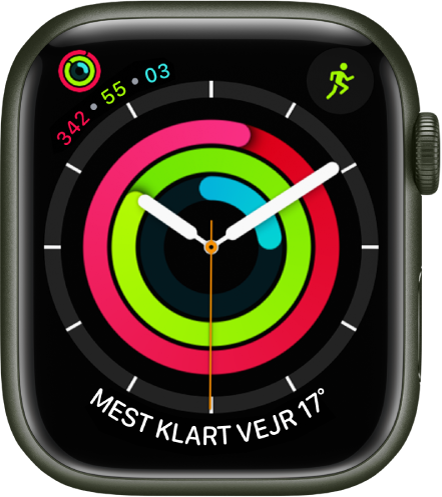 Urskiven Analog aktivitet, der viser tiden og status for dit mål for Bevægelse, Motion og Stå. Der er også tre komplikationer: Aktivitet øverst til venstre, Træning øverst til højre og Vejrforhold nederst.