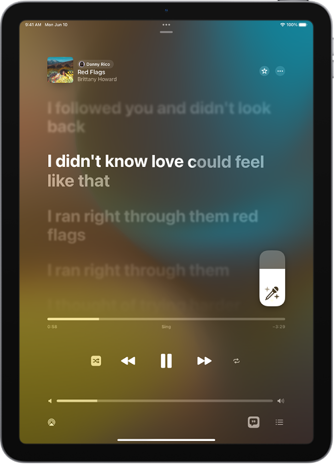 The Now Playing screen showing the Apple Music Sing slider to the right of the lyrics. The currently playing lyrics are highlighted.