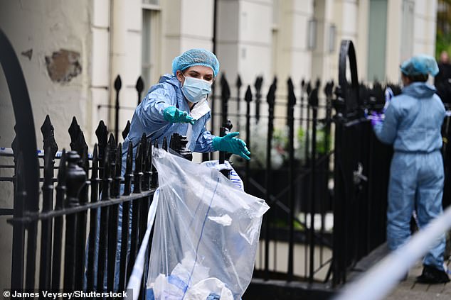 Forensic officers gather evidence at the scene where Ms Thiamphanit was knifed to death