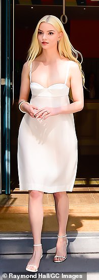 The dress featured spaghetti straps, a tight bodice, and a flowing knee-length skirt