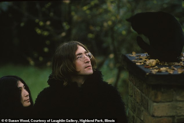 John and Yoko again, this time staring up at the sky while sporting all-black ensembles in 1969