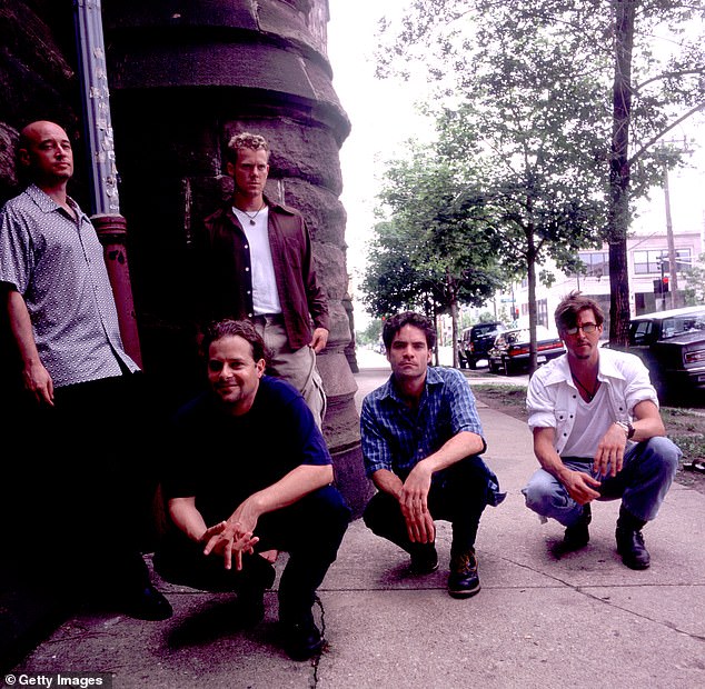 Lead singer Pat Monahan called Colin a 'unique' bass player and a legend; Train, left to right: Jimmy Stafford, Rob Hotchkiss, Scott Underwood, Monahan, Charlie Colin, in Chicago, Illinois, July 3, 1998