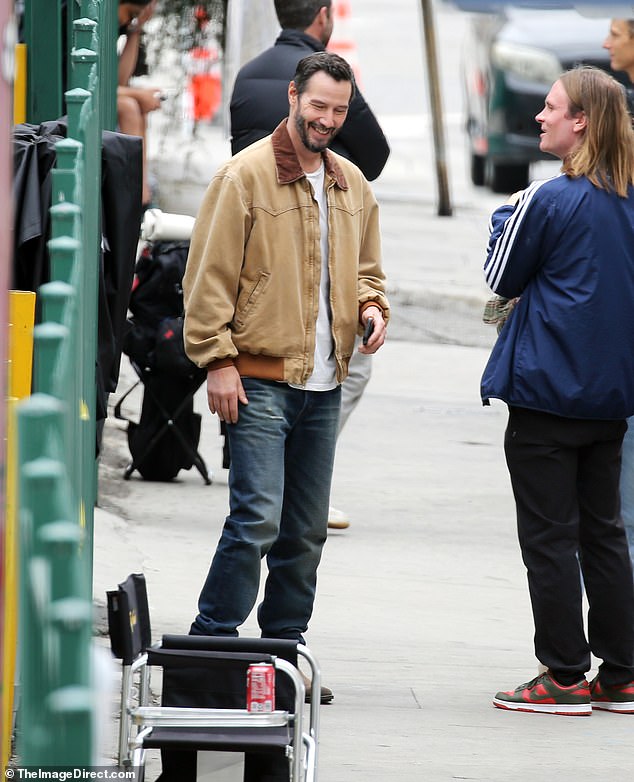 He flashed a smile as he chatted with a pal