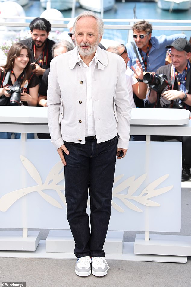 Fabrice Luchini, 72, cut a smart casual figure in a grey button-up jacket, a white shirt, and denim jeans