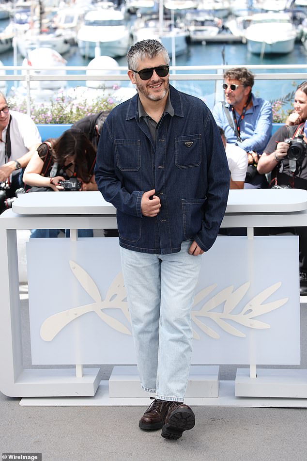 Meanwhile, director Christophe Honoré, 54, cut a casual figure in a blue denim jacket and jeans and seemed in high spirits during the event