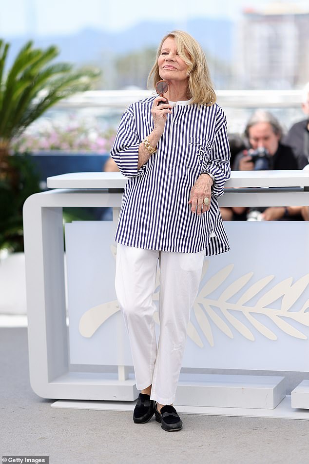 Nicole Garcia, 78, cut a stylish figure in a navy blue and white striped shirt before adding a pair of smart black loafers