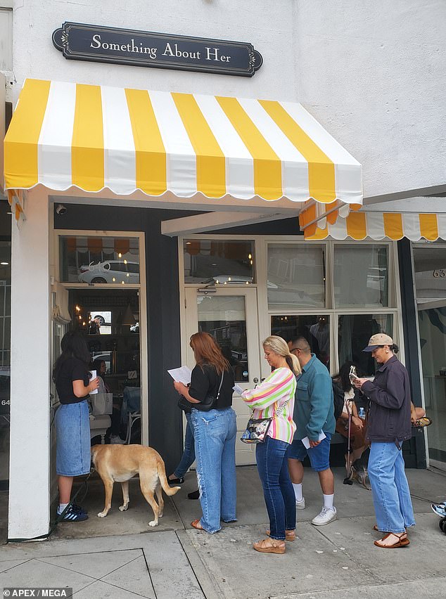 Several staff members clad in black 'Something About Her' T-shirts happily waited on customers as they poured over the thoughtfully tailored menu with sandwiches named after actresses Reese Witherspoon, Drew Barrymore and even Maloney's mother Teri