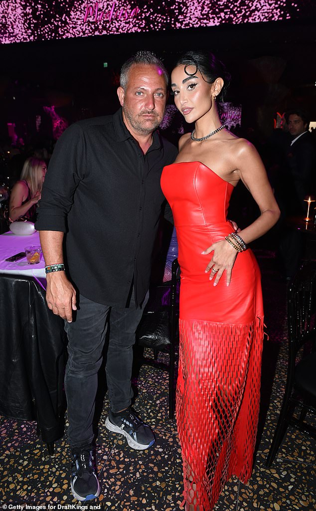 Mony Helal wowed in a red leather dress as she posed with Adel Ghazzawi