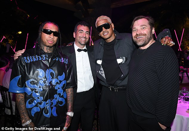 Tyga, John Terzian, Alexander "AE" Edwards and co-founder and president of DraftKings Matthew Kalish looked in good spirits at the bash