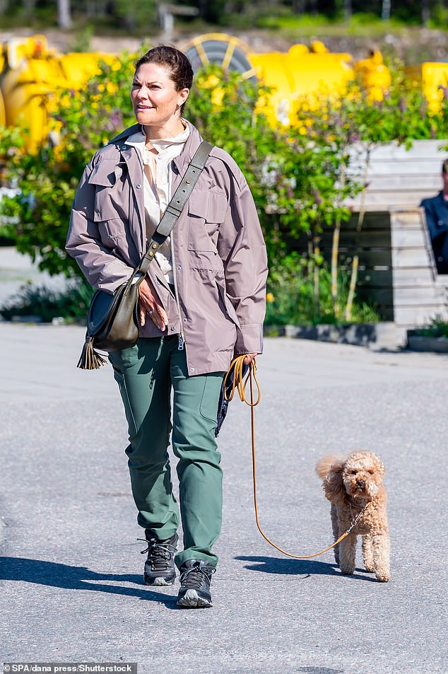 Crown Princess Victoria of Sweden (pictured) was accompanied by her dog Rio on Thursday morning as she attended a World Wildlife Fund event